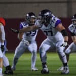 offensive lineman Quinn Meinerz (77) prepares to pass block during the Division III football championship game between the UW-Whitewater Warhawks and North Central College Cardinals at Woodforest Bank Stadium on December 20, 2019 in Shenandoah, Texas.