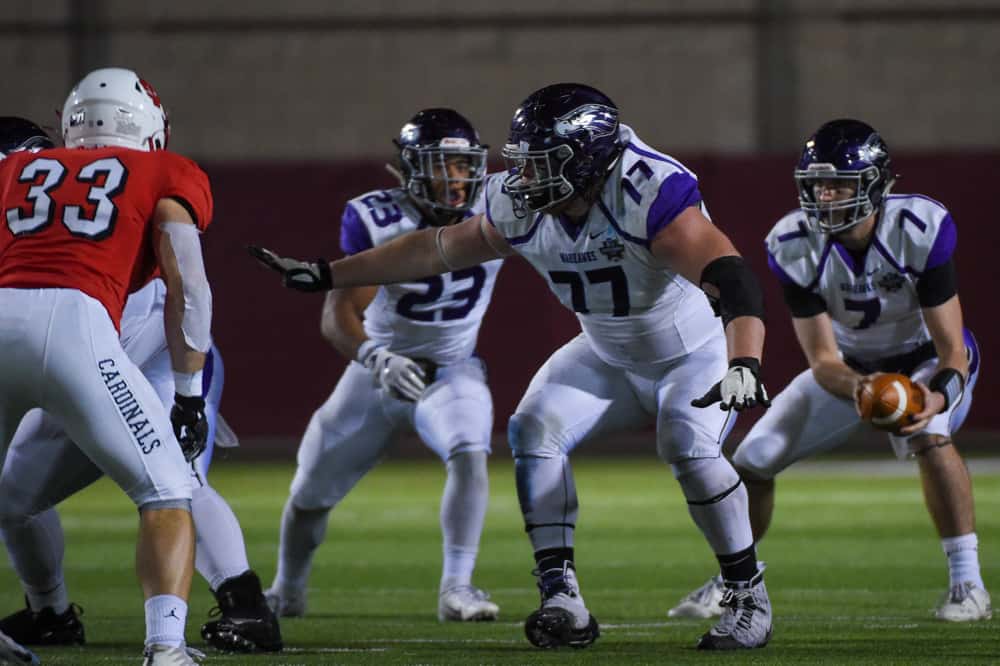 offensive lineman Quinn Meinerz (77) prepares to pass block during the Division III football championship game between the UW-Whitewater Warhawks and North Central College Cardinals at Woodforest Bank Stadium on December 20, 2019 in Shenandoah, Texas. 