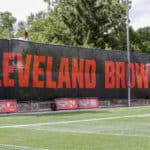 A Cleveland Browns banner hangs on the fence of the Cleveland Browns training facility during the Cleveland Browns Training Camp on August 29, 2020, at the at the Cleveland Browns Training Facility in Berea, Ohio.