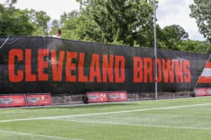 A Cleveland Browns banner hangs on the fence of the Cleveland Browns training facility during the Cleveland Browns Training Camp on August 29, 2020, at the at the Cleveland Browns Training Facility in Berea, Ohio.