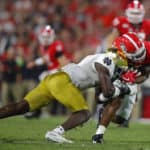 Georgia Bulldogs running back Brian Herrien (35) is tackled by Notre Dame Fighting Irish linebacker Jeremiah Owusu-Koramoah (6) during the second half of the Notre Dame Fighting Irish v Georgia Bulldogs game on September 21, 2019 at Sanford Stadium in Athens, GA.