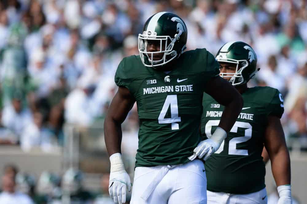 Spartans defensive tackle Malik McDowell (4) catches his breath between plays during a Big Ten Conference NCAA football game between Michigan State and Wisconsin at Spartan Stadium, East Lansing, MI. 