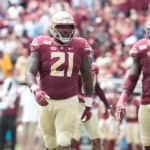 Florida State Seminoles defensive tackle Marvin Wilson (21) and Florida State Seminoles defensive end Janarius Robinson (11) line up for a play during the game between the Boise State Broncos and the Florida State Seminoles at Doak Campbell Stadium in Tallahassee, Florida on Saturday, August 31st, 2019.