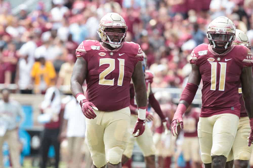 Florida State Seminoles defensive tackle Marvin Wilson (21) and Florida State Seminoles defensive end Janarius Robinson (11) line up for a play during the game between the Boise State Broncos and the Florida State Seminoles at Doak Campbell Stadium in Tallahassee, Florida on Saturday, August 31st, 2019.