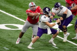 Ohio State Buckeyes defensive tackle Tommy Togiai (72) gets pressure on Northwestern Wildcats quarterback Peyton Ramsey (12) during the Big 10 Championship game between the Northwestern Wildcats and Ohio State Buckeyes on December 19, 2020, at Lucas Oil Stadium in Indianapolis, IN.