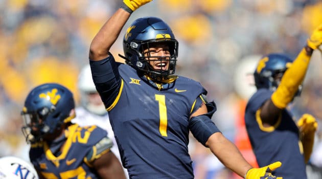West Virginia Mountaineers linebacker Tony Fields II (1) celebrates after making a tackle on Kansas Jayhawks wide receiver Luke Grimm (80) during the first quarter of the college football game between the Kansas Jayhawks and the West Virginia Mountaineers on October 17, 2020, at Mountaineer Field at Milan Puskar Stadium in Morgantown, WV. Fields II was called for a horse collar tackle on the play.