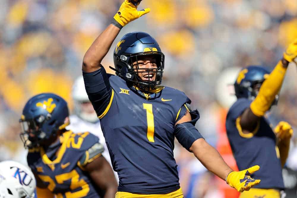 West Virginia Mountaineers linebacker Tony Fields II (1) celebrates after making a tackle on Kansas Jayhawks wide receiver Luke Grimm (80) during the first quarter of the college football game between the Kansas Jayhawks and the West Virginia Mountaineers on October 17, 2020, at Mountaineer Field at Milan Puskar Stadium in Morgantown, WV. Fields II was called for a horse collar tackle on the play.