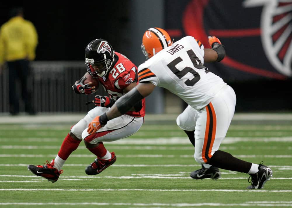 Atlanta Falcons running back Warrick Dunn (28) is tackled by Cleveland Browns linebacker Andra Davis (54) in the Cleveland Browns 17-13 victory over the Atlanta Falcons at the Georgia Dome in Atlanta Georgia.