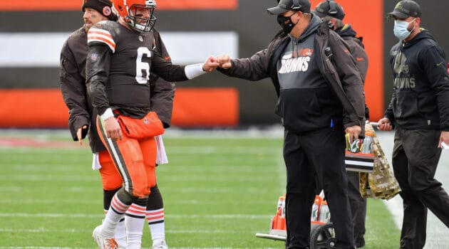 Quarterback Baker Mayfield #6 of the Cleveland Browns is greeted by offensive coordinator Alex Van Pelt as he walks off the field during the first half of the NFL game against the Las Vegas Raiders at FirstEnergy Stadium on November 01, 2020 in Cleveland, Ohio.