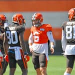 Quarterback Baker Mayfield #6 of the Cleveland Browns talks to wide receiver KhaDarel Hodge #12 wide receiver Jarvis Landry #80 tight end Austin Hooper #81 during an NFL training camp at the Browns training facility on August 18, 2020 in Berea, Ohio.