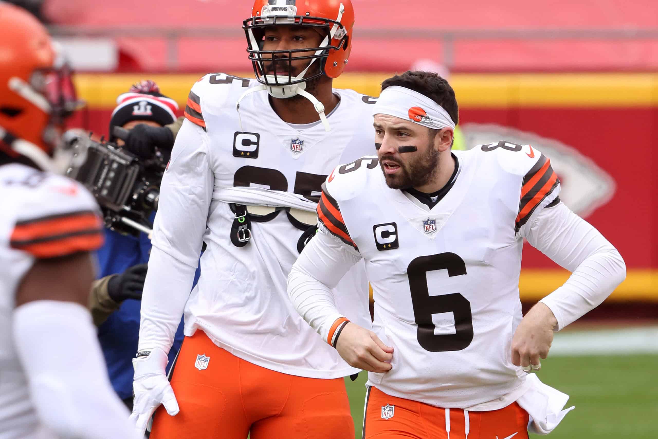 JANUARY 17: Quarterback Baker Mayfield #6 of the Cleveland Browns and defensive end Myles Garrett #95 warm up prior to the AFC Divisional Playoff game against the Kansas City Chiefs at Arrowhead Stadium on January 17, 2021 in Kansas City, Missouri. 