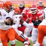 Quarterback Baker Mayfield #6 of the Cleveland Browns drops back to pass against the defense of the Kansas City Chiefs during the AFC Divisional Playoff game at Arrowhead Stadium on January 17, 2021 in Kansas City, Missouri.
