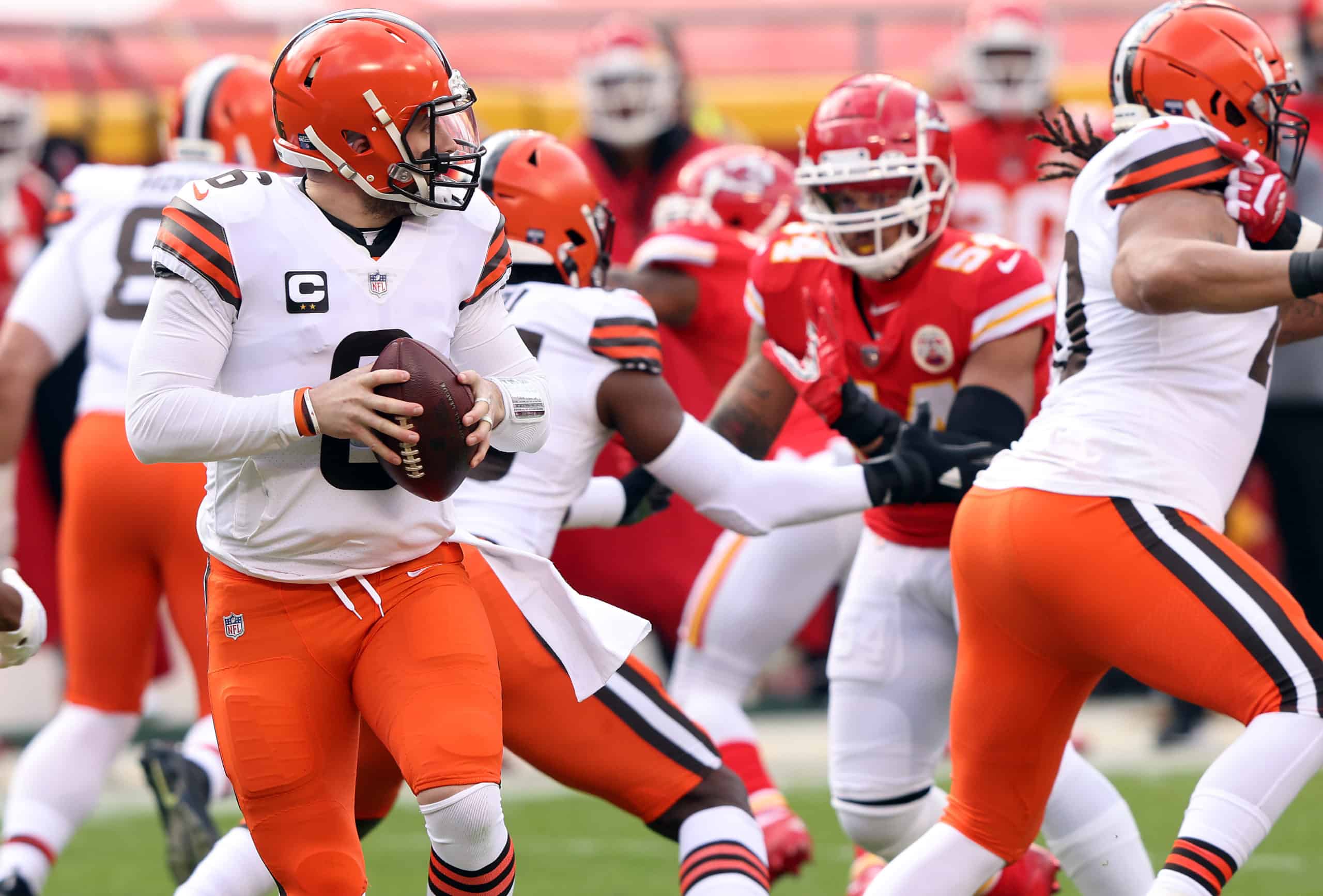 Quarterback Baker Mayfield #6 of the Cleveland Browns drops back to pass against the defense of the Kansas City Chiefs during the AFC Divisional Playoff game at Arrowhead Stadium on January 17, 2021 in Kansas City, Missouri. 