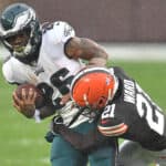 Miles Sanders #26 of the Philadelphia Eagles is brought down by Denzel Ward #21 of the Cleveland Browns during the first half at FirstEnergy Stadium on November 22, 2020 in Cleveland, Ohio.