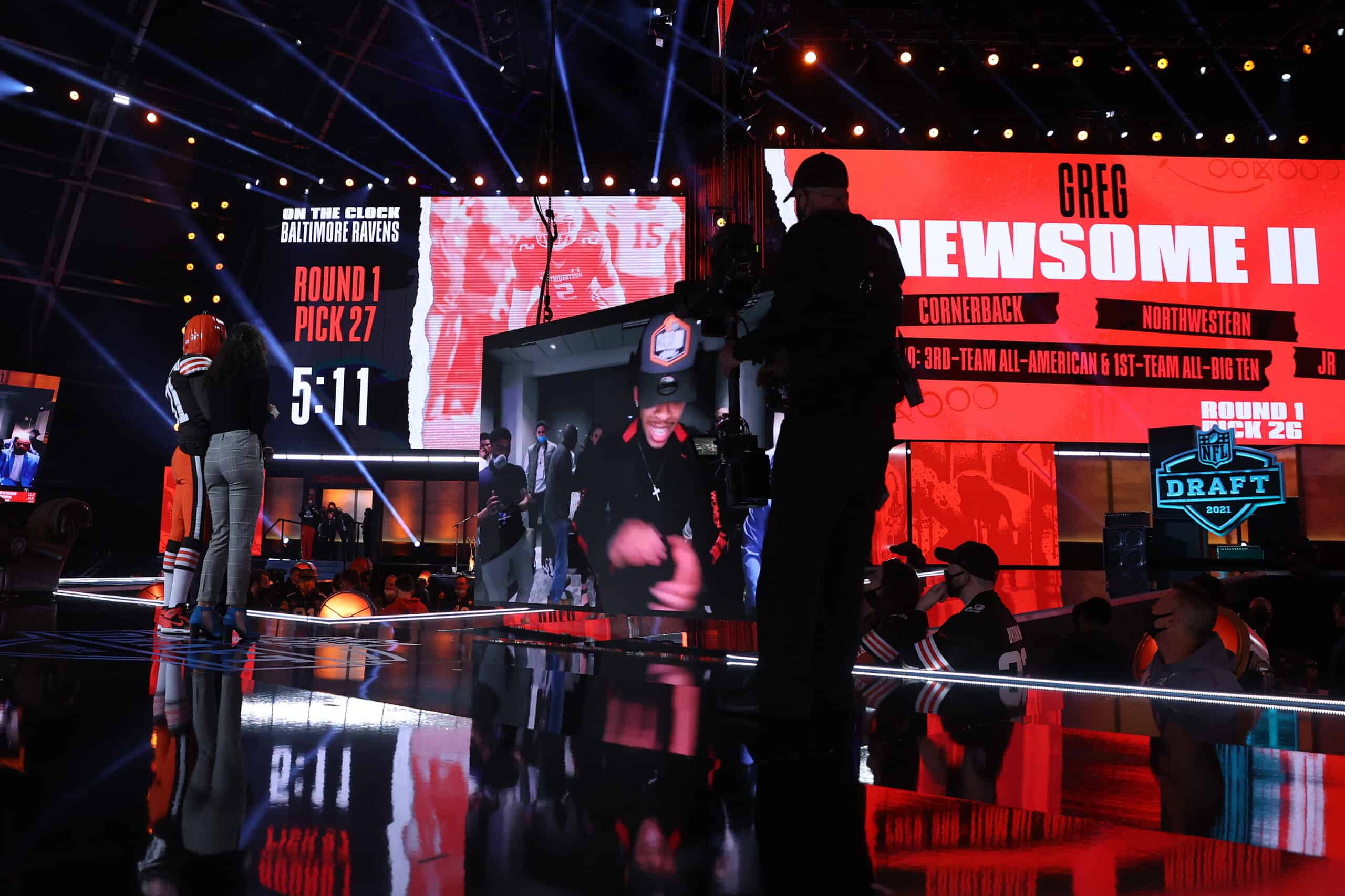 Mya Tomoto stands with NFL Commissioner Roger Goodell after announcing Greg Newsome II as the 26th pick by the Cleveland Browns during round one of the 2021 NFL Draft at the Great Lakes Science Center on April 29, 2021 in Cleveland, Ohio.