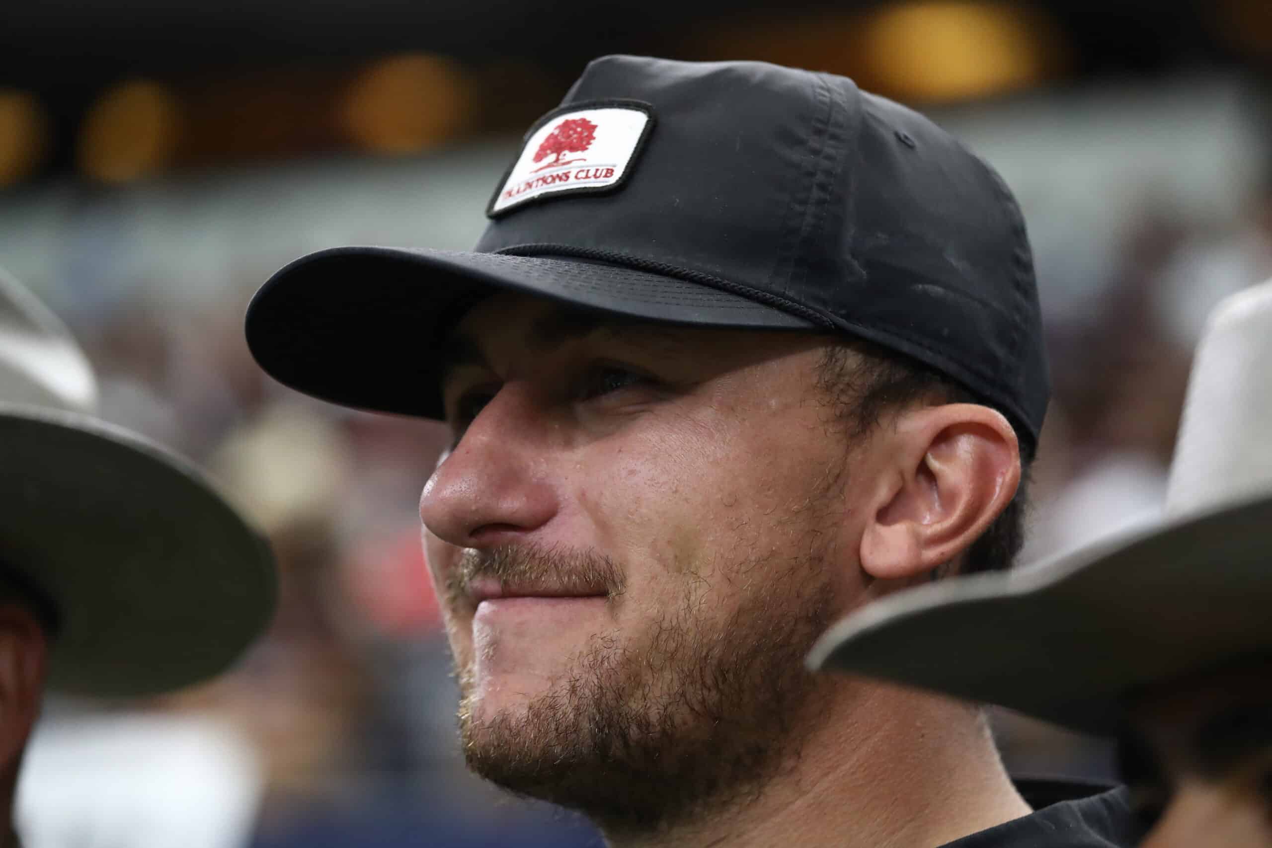 Johnny Manziel watches play between the Texas A&M Aggies and the Arkansas Razorbacks during the Southwest Classic at AT&T Stadium on September 28, 2019 in Arlington, Texas. 