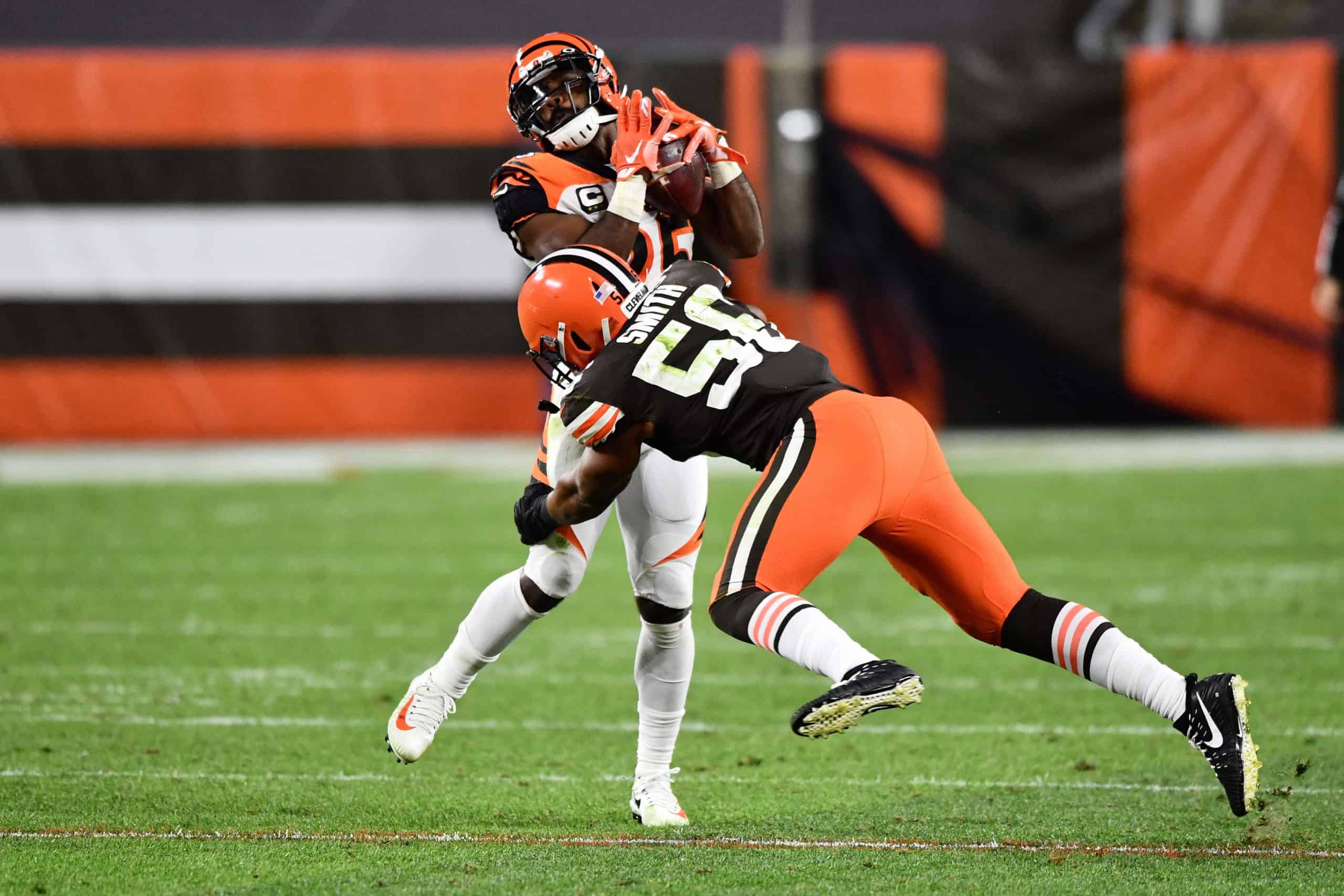 Giovani Bernard #25 of the Cincinnati Bengals is tackled by Malcolm Smith #56 of the Cleveland Browns after a pass reception in the fourth quarter at FirstEnergy Stadium on September 17, 2020 in Cleveland, Ohio. Cleveland defeated Cincinnati 35-30.