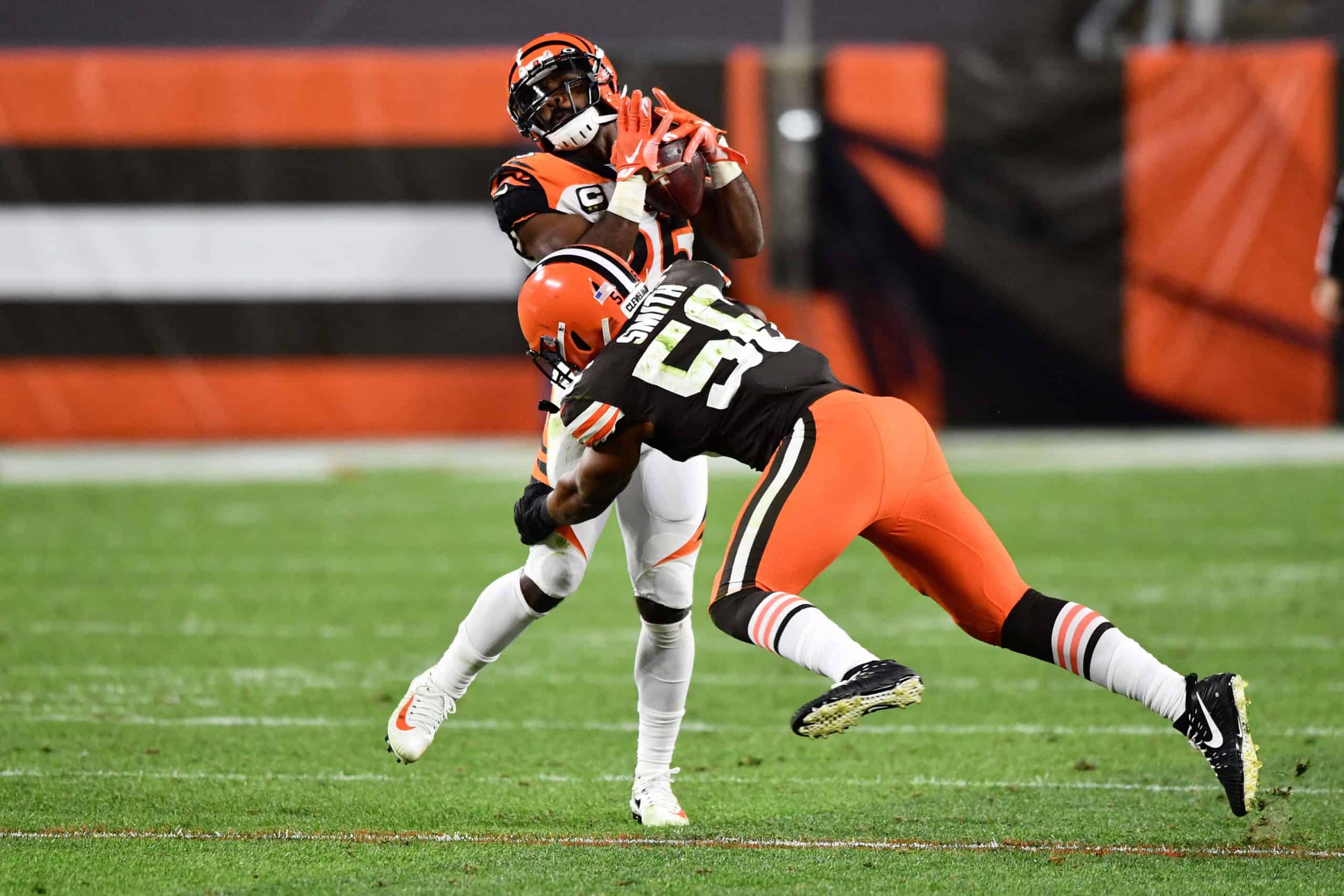 Giovani Bernard #25 of the Cincinnati Bengals is tackled by Malcolm Smith #56 of the Cleveland Browns after a pass reception in the fourth quarter at FirstEnergy Stadium on September 17, 2020 in Cleveland, Ohio. Cleveland defeated Cincinnati 35-30. 