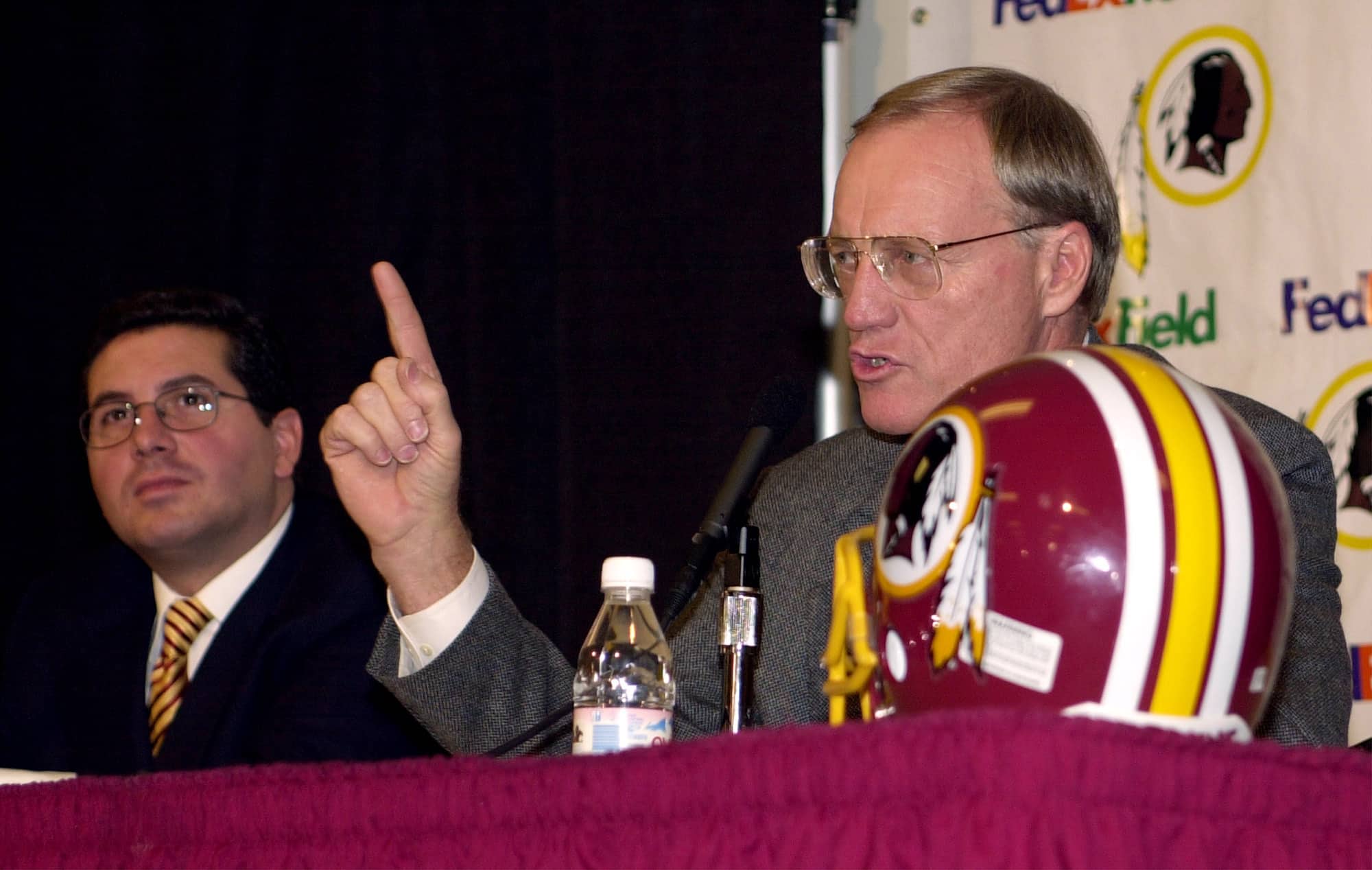 New head coach Marty Schottenheimer of the Washington Redskins fields questions from the media as team owner Daniel Snyder (left) look on during a press conference to announce the signing of Schottenheimer's four-year ten million dollar contract at Redskin Park in Ashburn, Virginia. DIGITAL IMAGE 