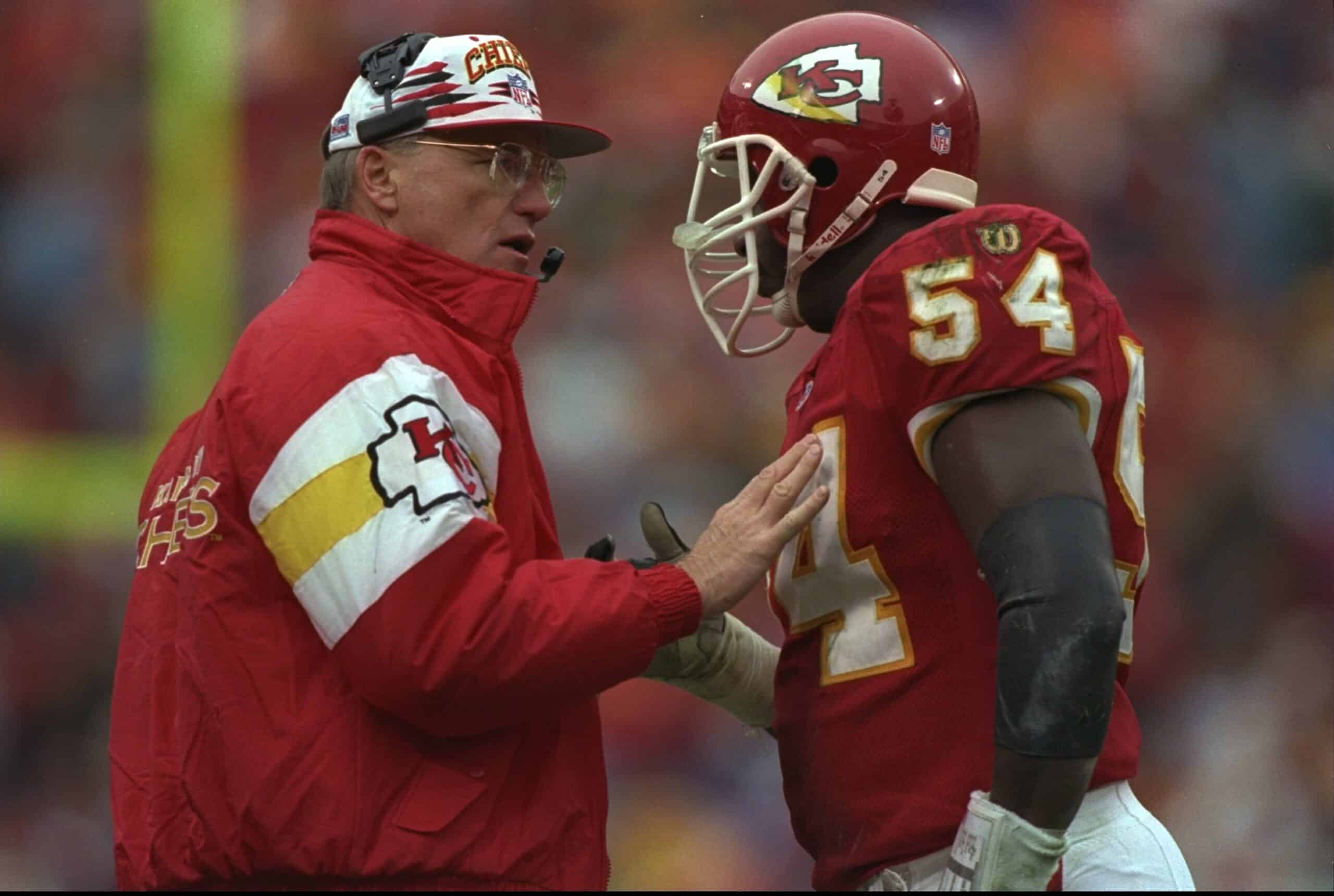 Head coach Marty Schottenheimer of the Kansas City Chiefs (left) talks with his linebacker Tracy Simien during a game against the Green Bay Packers at Arrowhead Stadium in Kansas City, Missouri. The Chiefs won the game 27-20. Mandatory Cred