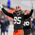 Myles Garrett #95 of the Cleveland Browns pumps up the crowd in the fourth quarter against the Indianapolis Colts at FirstEnergy Stadium on October 11, 2020 in Cleveland, Ohio.