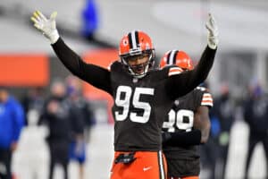 Myles Garrett #95 of the Cleveland Browns pumps up the crowd in the fourth quarter against the Indianapolis Colts at FirstEnergy Stadium on October 11, 2020 in Cleveland, Ohio.