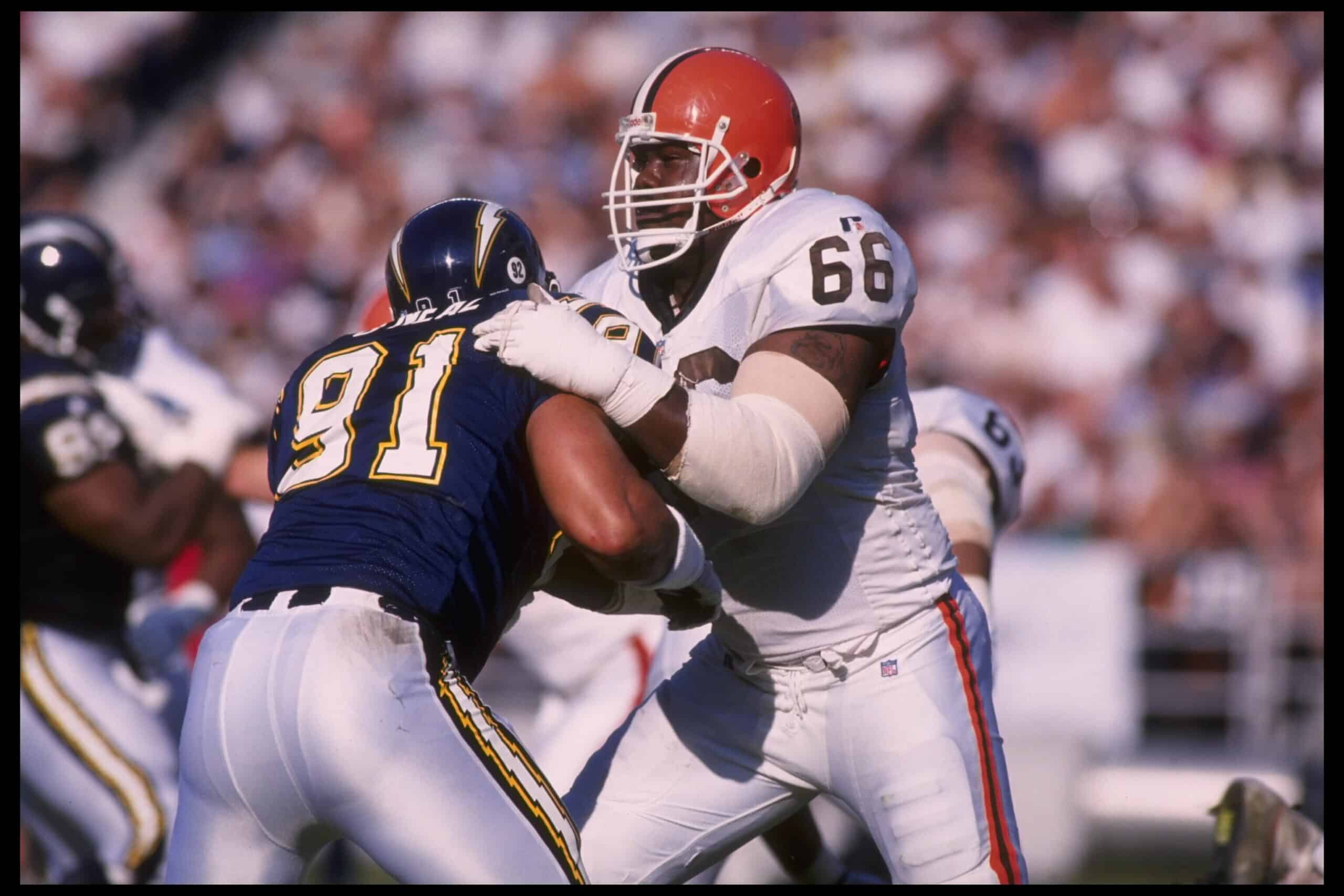 Tackle Tony Jones #66 of the Cleveland Browns tries to keep defensive end Leslie O'Neal #91 of the San Diego Chargers far away from his quarterback at Jack Murphy Stadium in San Diego, California. The Chargers defeated the Browns 31-13. Man