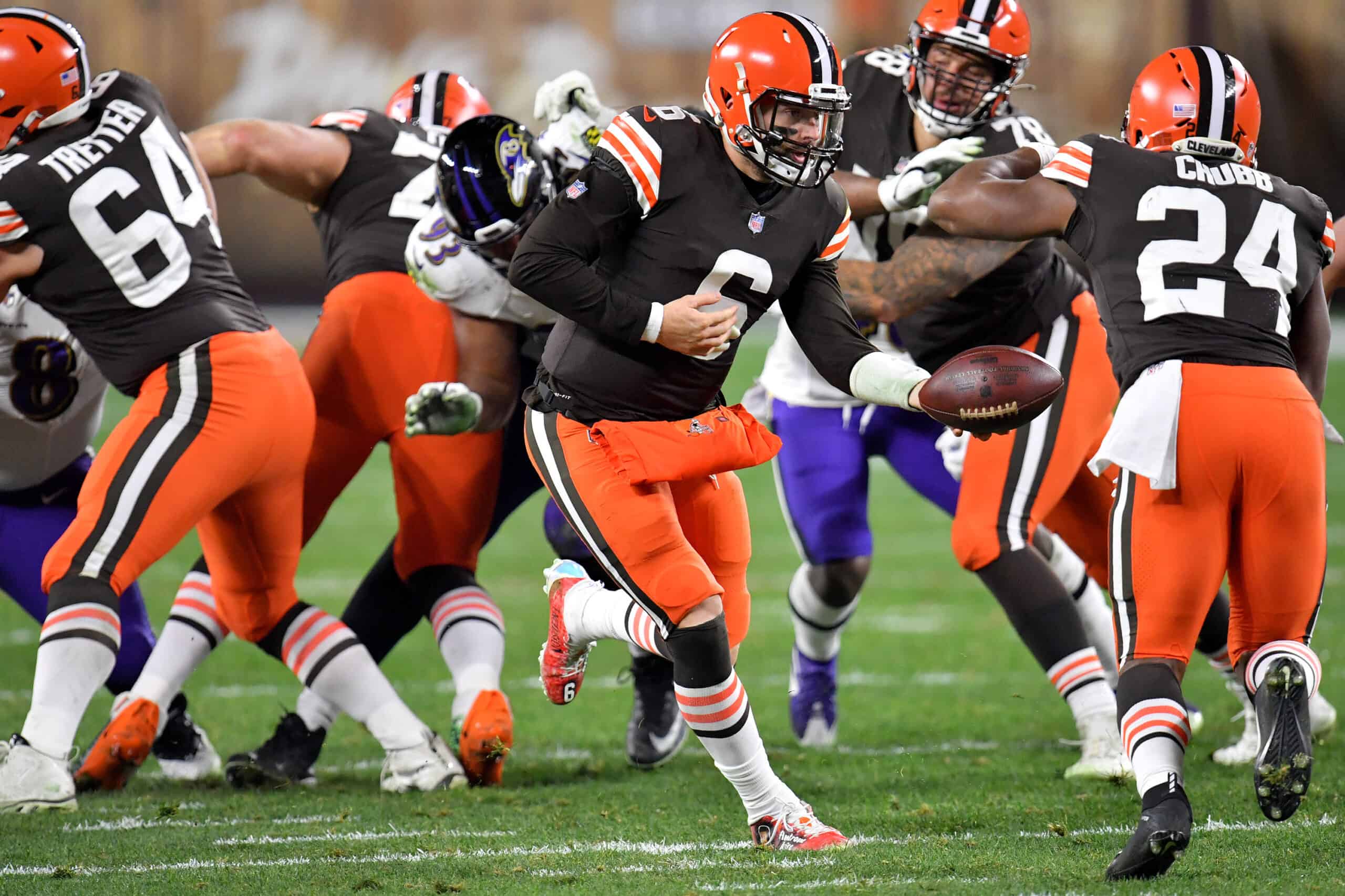 Baker Mayfield #6 of the Cleveland Browns hands the ball to Nick Chubb #24 during the third quarter in the game at FirstEnergy Stadium on December 14, 2020 in Cleveland, Ohio. 