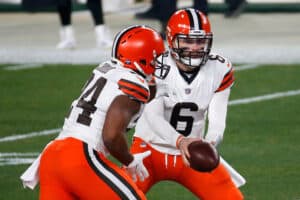 Baker Mayfield #6 of the Cleveland Browns attempts a handoff to Nick Chubb #24 during the first half of the AFC Wild Card Playoff game against the Pittsburgh Steelers at Heinz Field on January 10, 2021 in Pittsburgh, Pennsylvania.