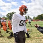 Defensive end Myles Garrett #95 of the Cleveland Browns talks with a member of the coaching staff during training camp at the Browns training facility on August 29, 2020 in Berea, Ohio.