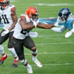 Nick Chubb #24 of the Cleveland Browns carries the ball against Kenny Vaccaro #24 of the Tennessee Titans in the first quarter at Nissan Stadium on December 06, 2020 in Nashville, Tennessee.