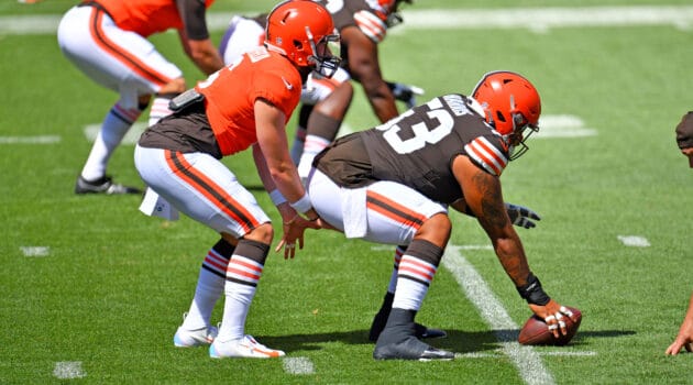 Quarterback Baker Mayfield #6 takes the snap from center Nick Harris #53 of the Cleveland Browns during training camp at FirstEnergy Stadium on August 30, 2020 in Cleveland, Ohio.
