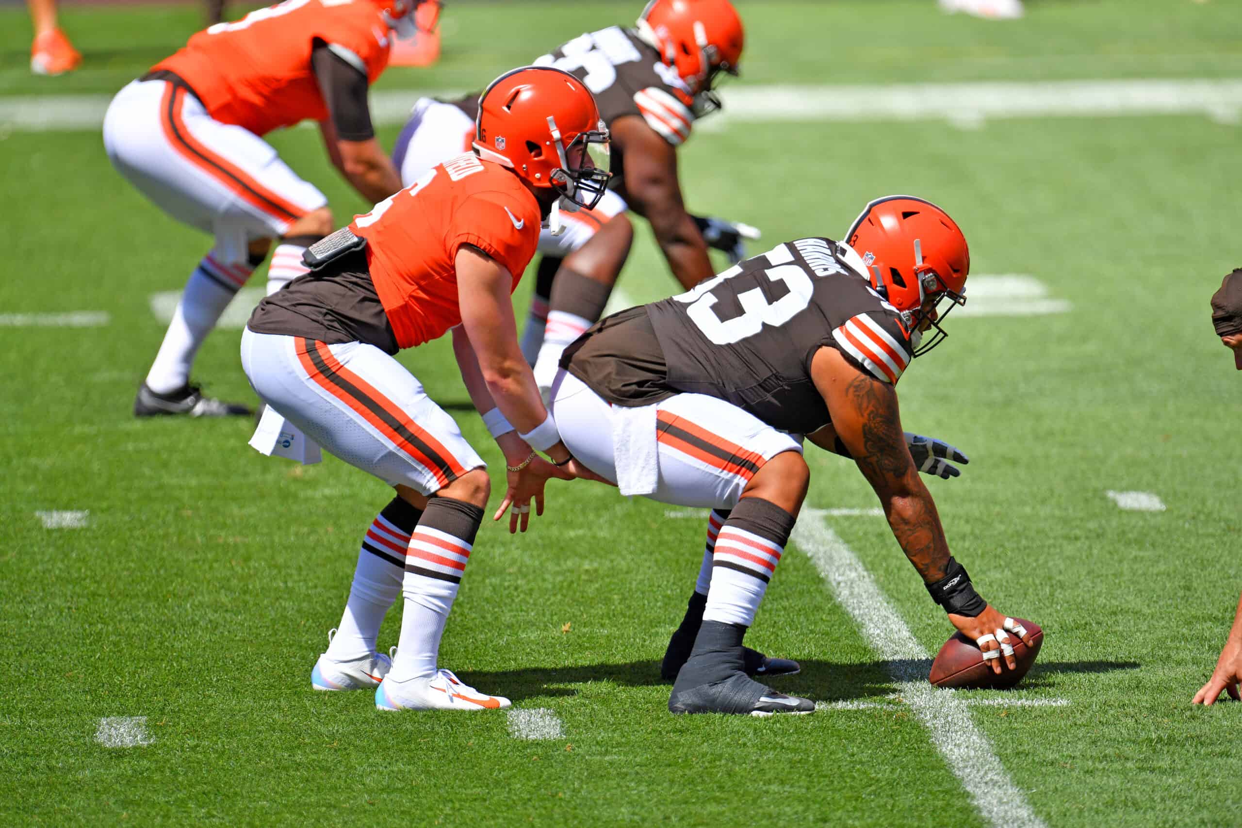 Quarterback Baker Mayfield #6 takes the snap from center Nick Harris #53 of the Cleveland Browns during training camp at FirstEnergy Stadium on August 30, 2020 in Cleveland, Ohio.