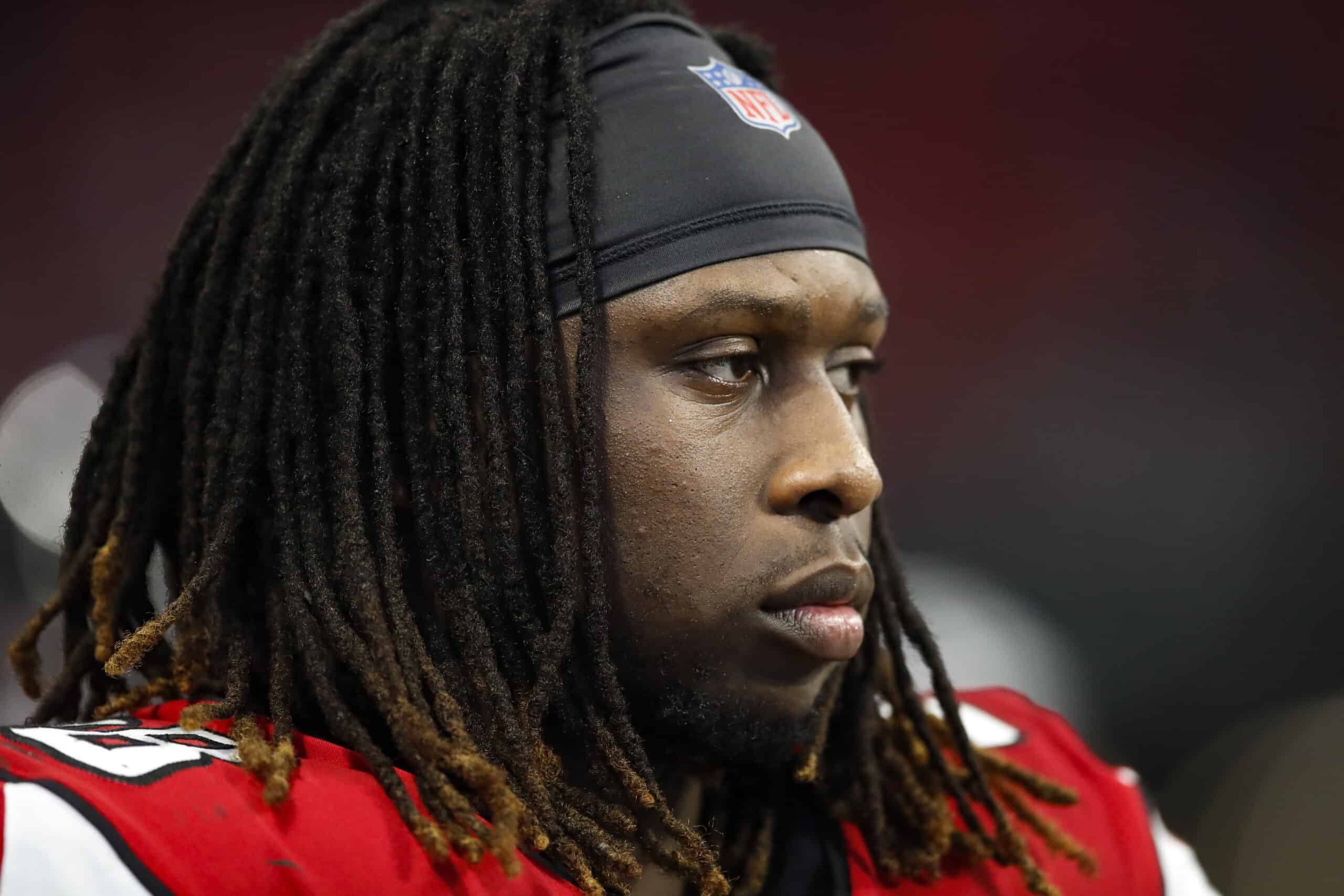 Takkarist McKinley #98 of the Atlanta Falcons watches on in the second half on an NFL game against the Carolina Panthers at Mercedes-Benz Stadium on December 8, 2019 in Atlanta, Georgia.