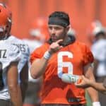 Quarterback Baker Mayfield #6 talks to wide receiver Anthony Schwartz #10 of the Cleveland Browns during the first day of Cleveland Browns Training Camp on July 28, 2021 in Berea, Ohio.