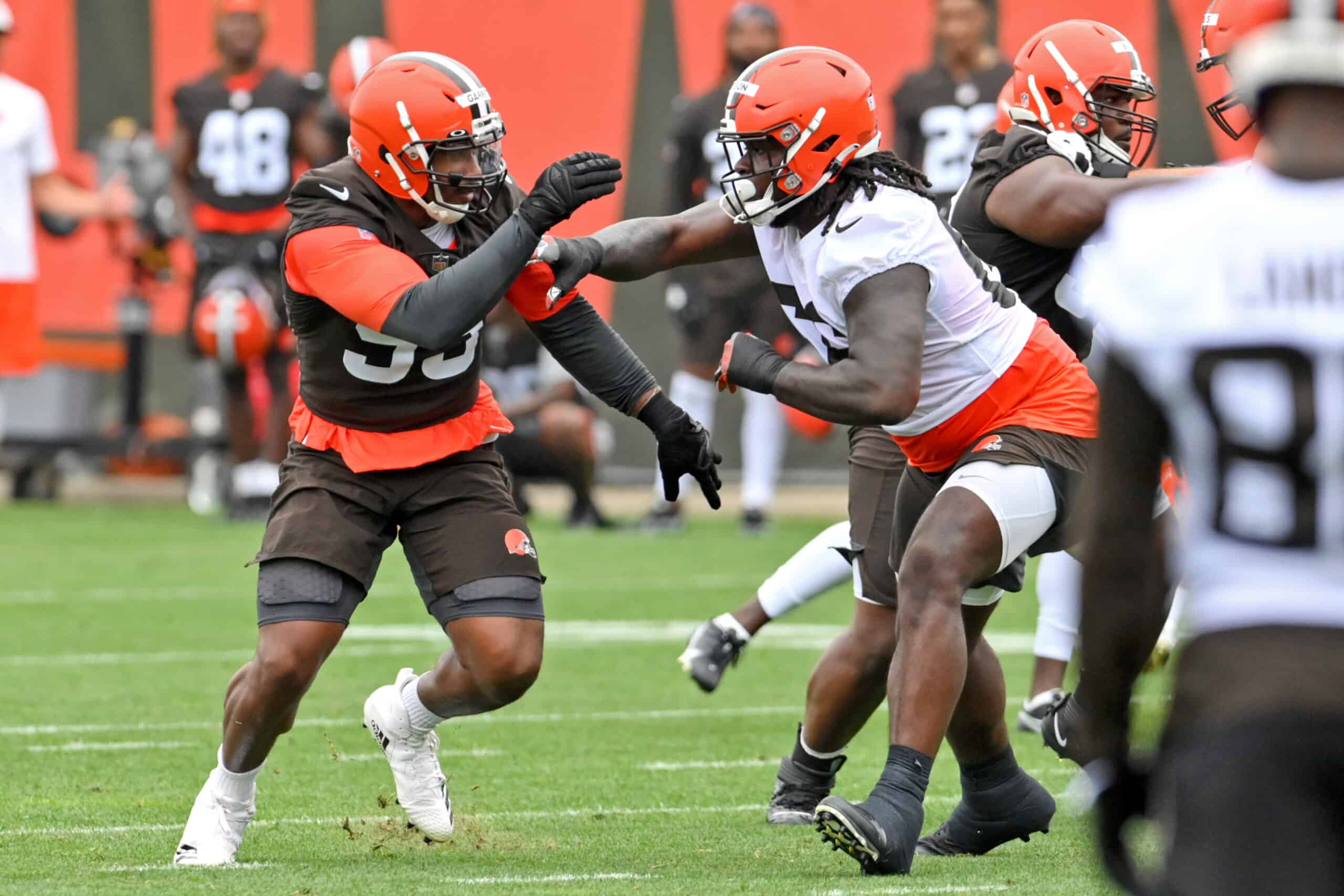 Offensive tackle James Hudson III #66 of the Cleveland Browns blocks defensive end Myles Garrett #95 during the second day of Cleveland Browns Training Camp on July 29, 2021 in Berea, Ohio.