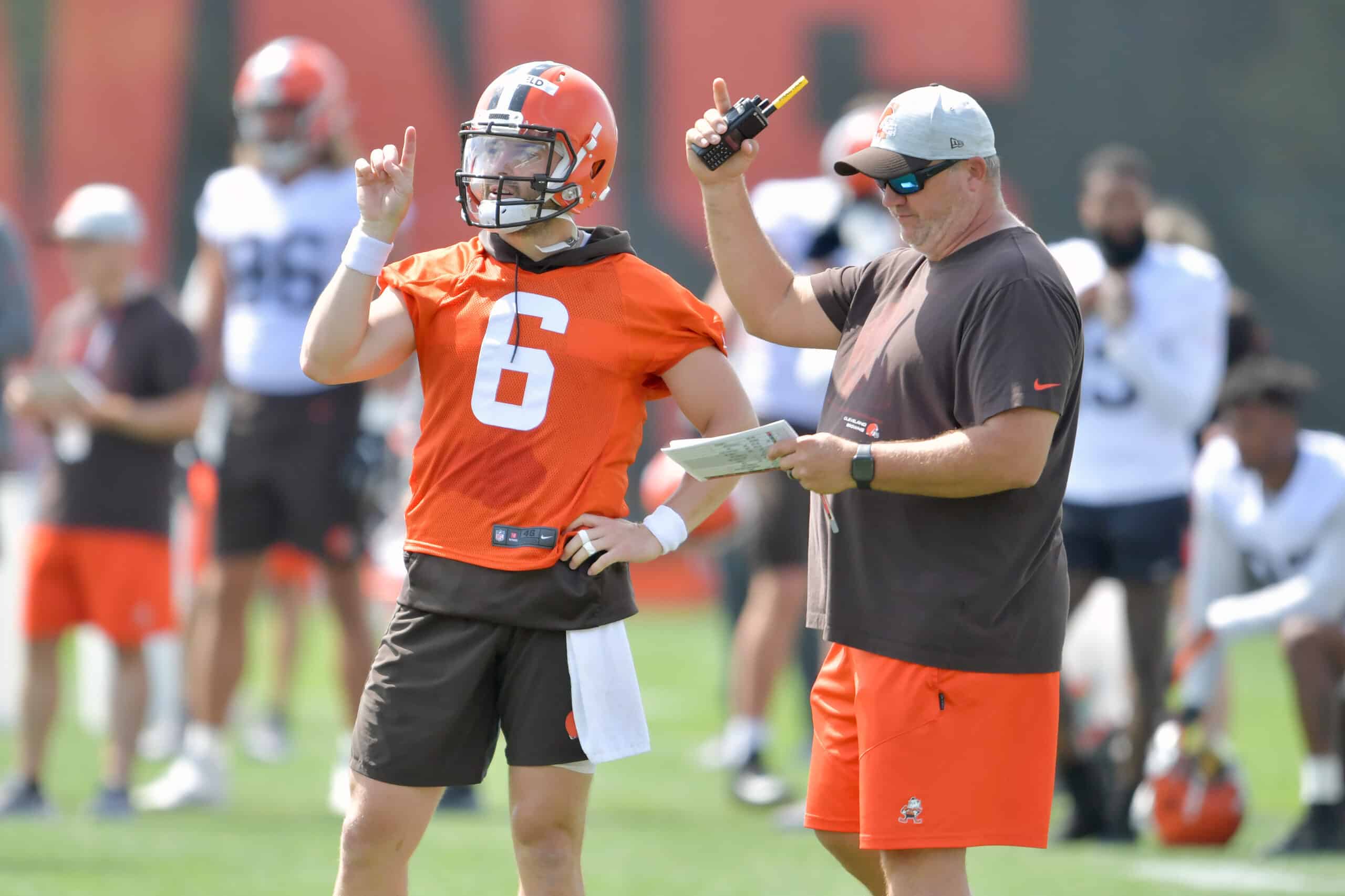 Quarterback Baker Mayfield #6 talks with offensive coordinator Alex Van Pelt during Cleveland Browns Training Camp on July 30, 2021 in Berea, Ohio.