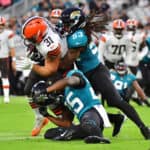 Andy Janovich #31 of the Cleveland Browns is brought down by Dakota Allen #53 and Jarrod Wilson #25 of the Jacksonville Jaguars in the first half during a preseason game at TIAA Bank Field on August 14, 2021 in Jacksonville, Florida.