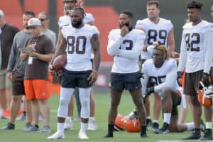 Wide receiver Jarvis Landry #80 and wide receiver Odell Beckham Jr. #13 of the Cleveland Browns watch from the sidelines during Cleveland Browns Training Camp on July 30, 2021 in Berea, Ohio.