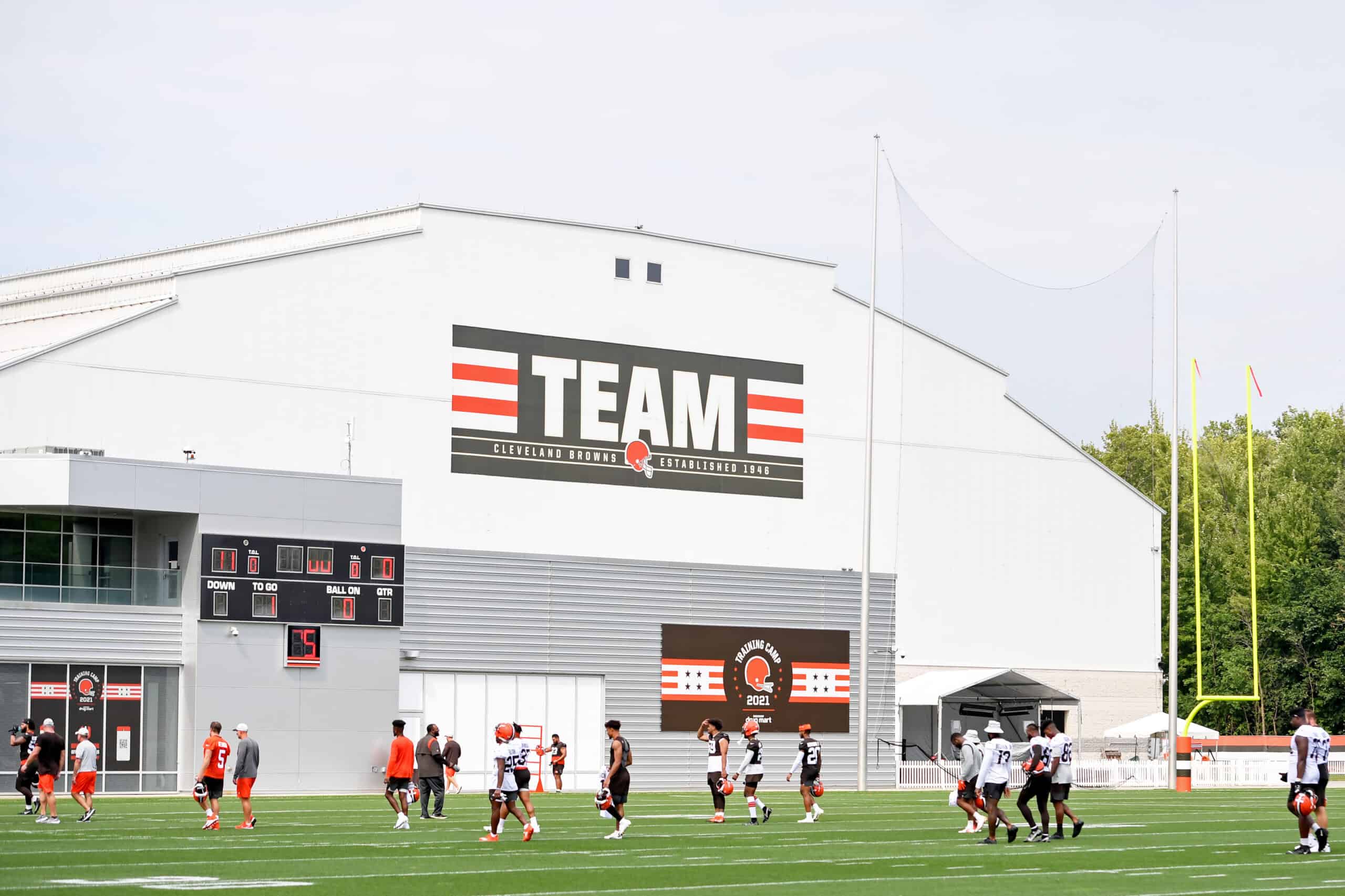 Cleveland Browns players walk off the field after the second day of Cleveland Browns Training Camp on July 29, 2021 in Berea, Ohio.