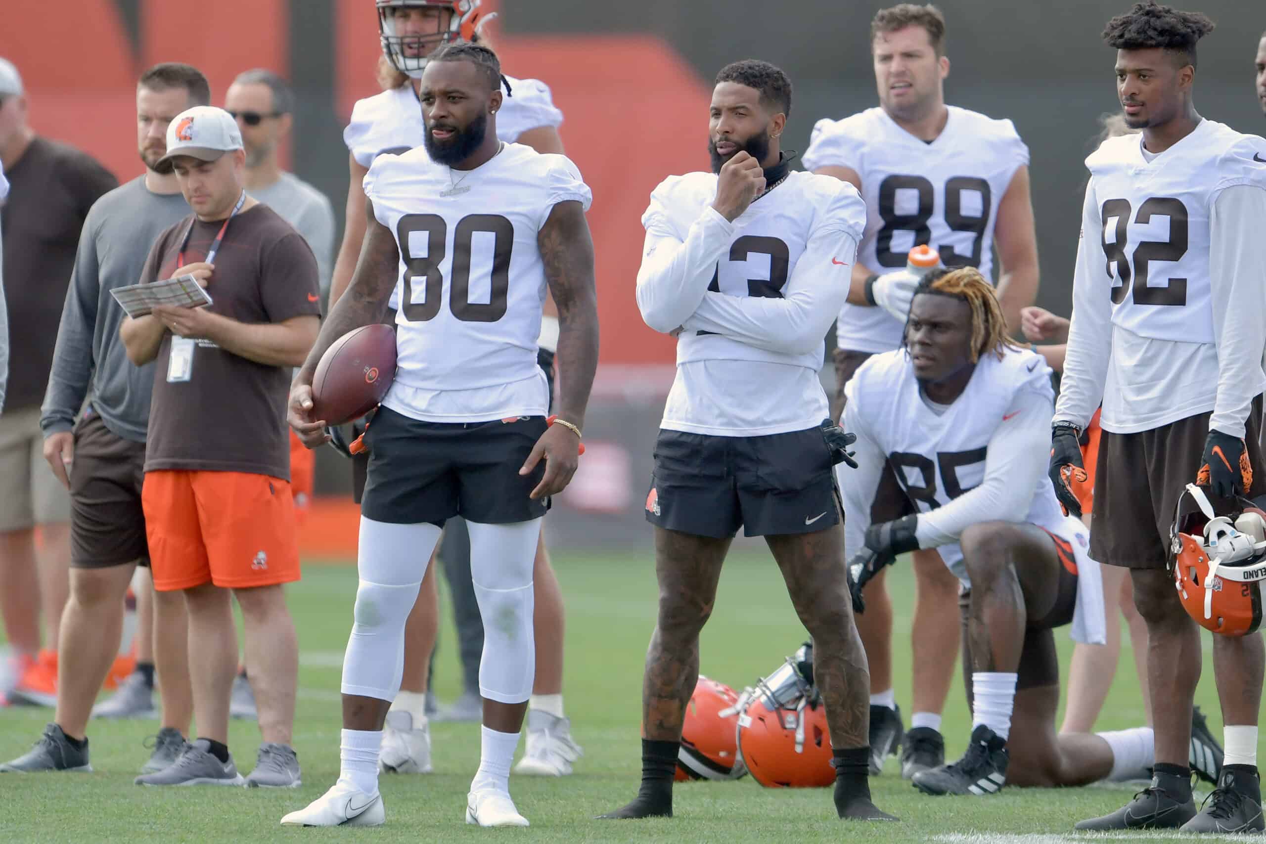 Wide receiver Jarvis Landry #80 and wide receiver Odell Beckham Jr. #13 of the Cleveland Browns watch from the sidelines during Cleveland Browns Training Camp on July 30, 2021 in Berea, Ohio. 