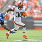 Linebacker Oshane Ximines #53 of the New York Giants misses the tackle on running back D'Ernest Johnson #30 of the Cleveland Browns during the first quarter at FirstEnergy Stadium on August 22, 2021 in Cleveland, Ohio.