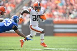 Linebacker Oshane Ximines #53 of the New York Giants misses the tackle on running back D'Ernest Johnson #30 of the Cleveland Browns during the first quarter at FirstEnergy Stadium on August 22, 2021 in Cleveland, Ohio.