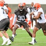 Defensive end Jadeveon Clowney #90 of the Cleveland Browns runs a drill during the second day of Cleveland Browns Training Camp on July 29, 2021 in Berea, Ohio.
