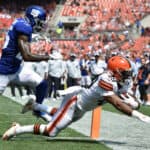 Cornerback Rodarius Williams #25 of the New York Giants is unable stop running back John Kelly #49 of the Cleveland Browns from scoring during the third quarter at FirstEnergy Stadium on August 22, 2021 in Cleveland, Ohio. The Browns defeated the Giants 17-13.