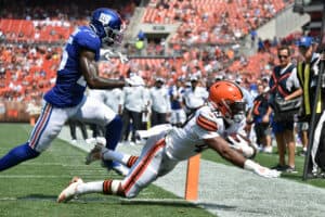 Cornerback Rodarius Williams #25 of the New York Giants is unable stop running back John Kelly #49 of the Cleveland Browns from scoring during the third quarter at FirstEnergy Stadium on August 22, 2021 in Cleveland, Ohio. The Browns defeated the Giants 17-13.