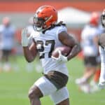 Running back Kareem Hunt #27 of the Cleveland Browns runs a drill during Cleveland Browns Training Camp on July 30, 2021 in Berea, Ohio.