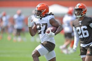 Running back Kareem Hunt #27 of the Cleveland Browns runs a drill during Cleveland Browns Training Camp on July 30, 2021 in Berea, Ohio.