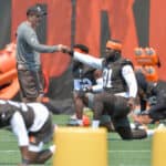 Head coach Kevin Stefanski talks with defensive end Joe Jackson #91 of the Cleveland Browns as he warms up during the first day of Cleveland Browns Training Camp on July 28, 2021 in Berea, Ohio.