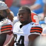 Running back Nick Chubb #24 of the Cleveland Browns watches from the bench during the fourth quarter against the New York Giants at FirstEnergy Stadium on August 22, 2021 in Cleveland, Ohio. The Browns defeated the Giants 17-13.